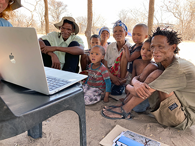 Laptop film screening for N!amace and family in Nyae Nyae. Photo: Frank Aveni