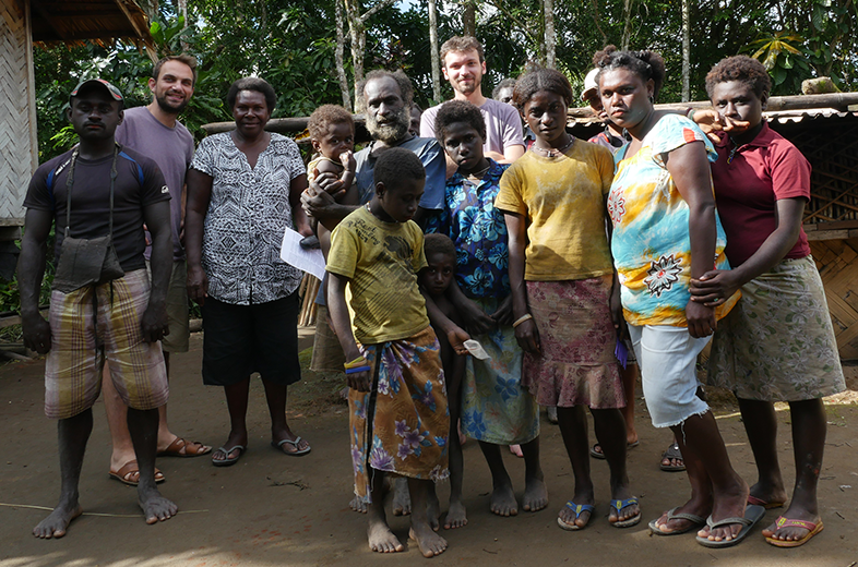 Filmmakers Olivier Pollet and Alexandre Berman with Bruno Idioai and community. Photo: Nathan Matbob